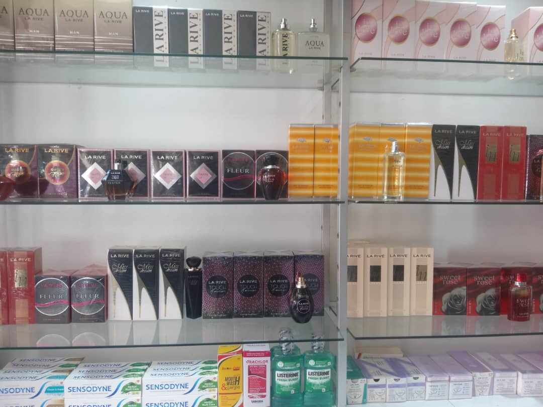 Lomagundi Pharmacy team keeping shelves stocked